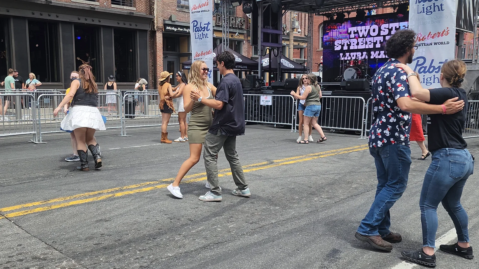 People enjoying Lower Broadway during the daytime.