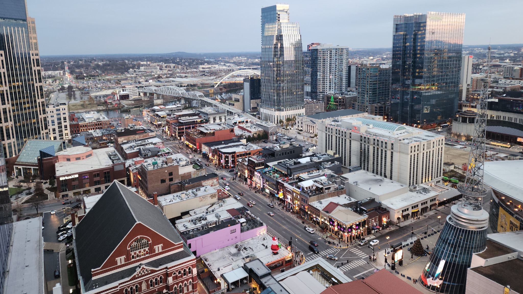 An elevated view of Lower Broadway, the Ryman, Bridgestone Arena and nearby downtown blocks.