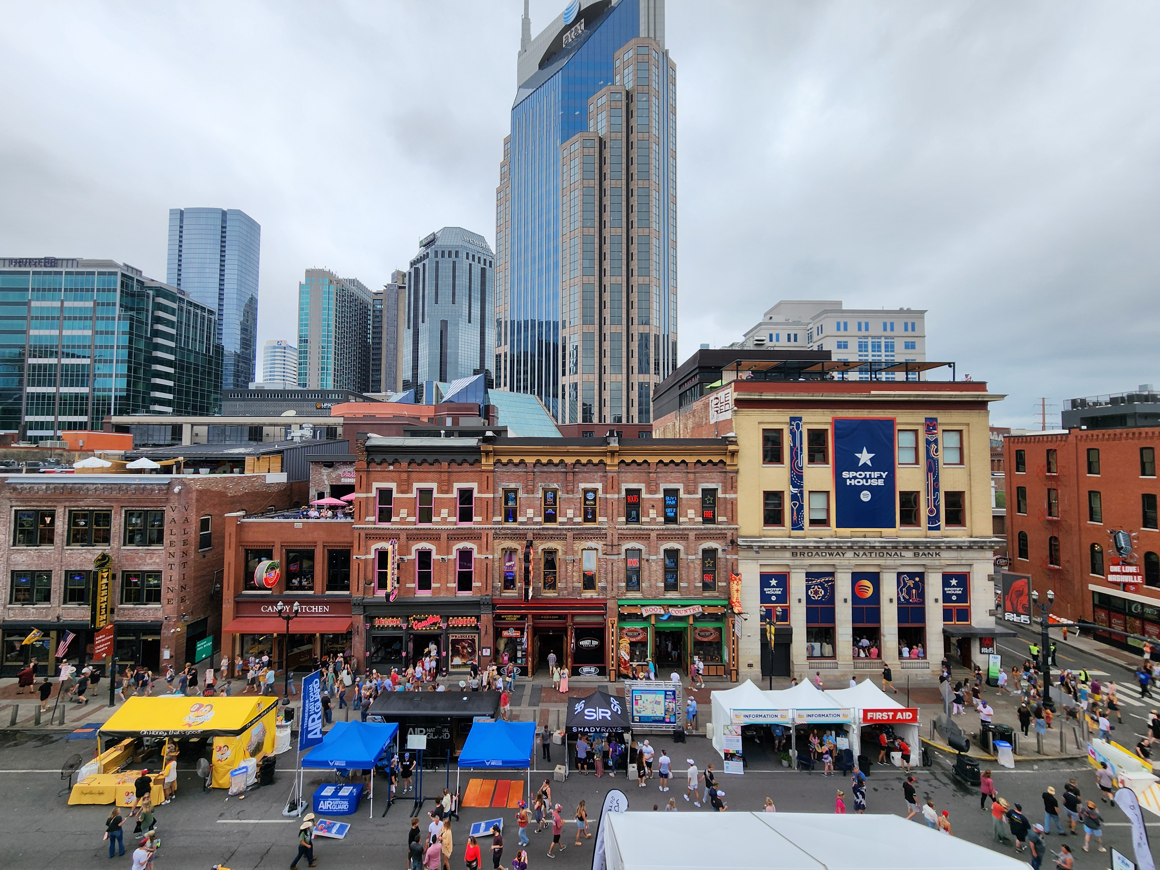 Ole Red and neighboring Broadway buildings viewed from above during a daytime street event.