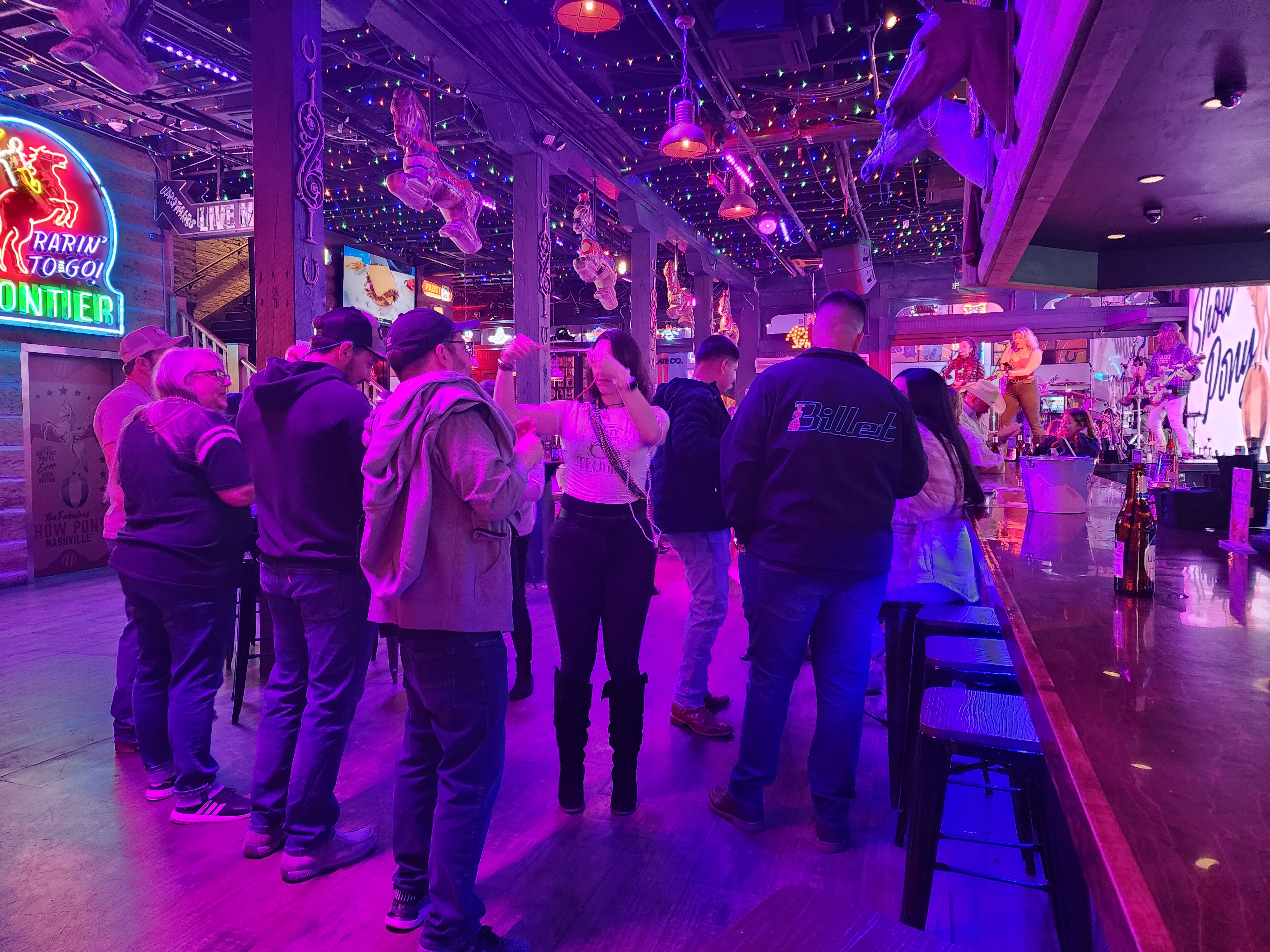 A live band performs inside a busy Lower Broadway bar.