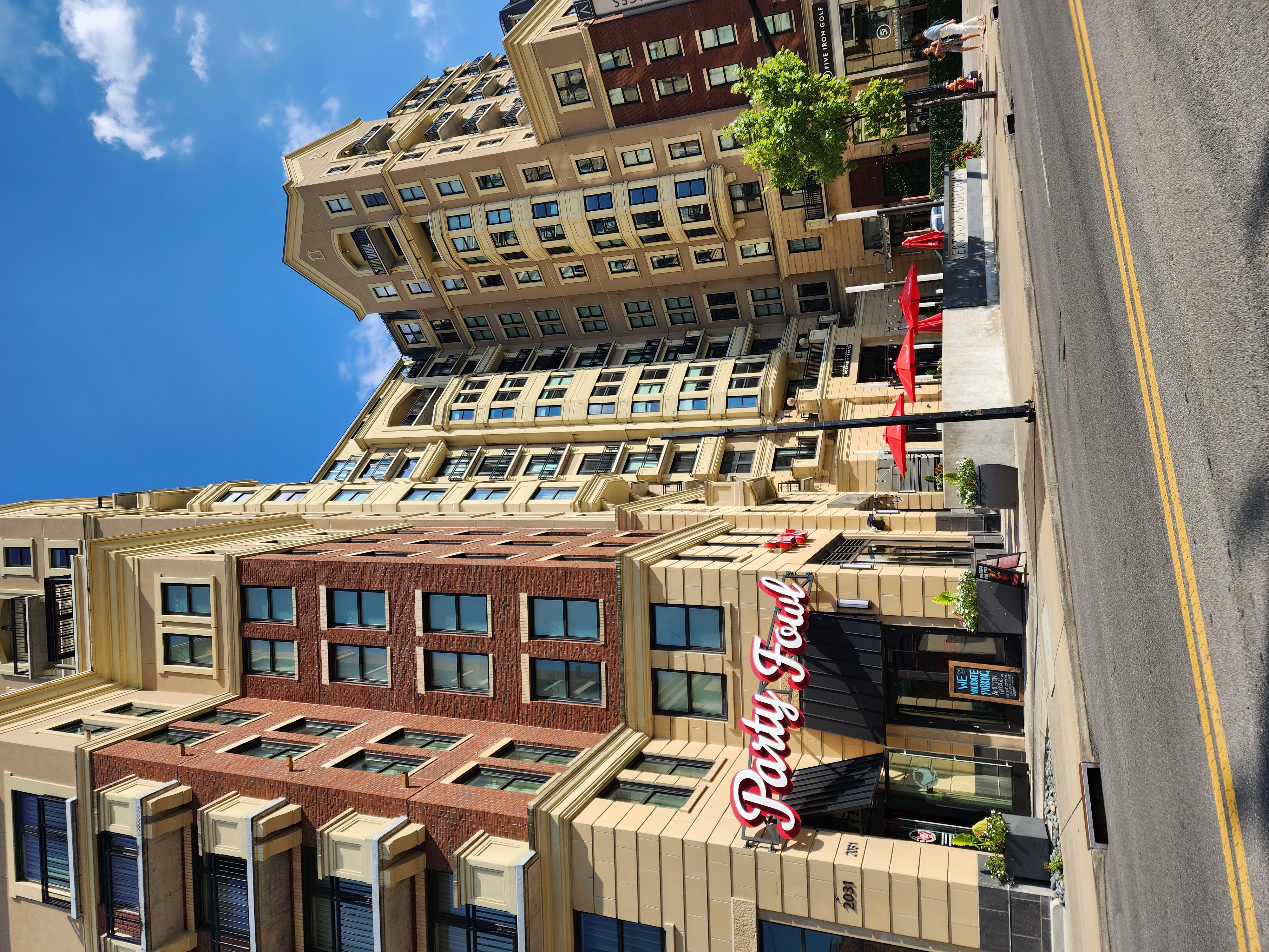 Aertson Midtown apartments and the Party Fowl storefront along Division Street in Midtown Nashville.