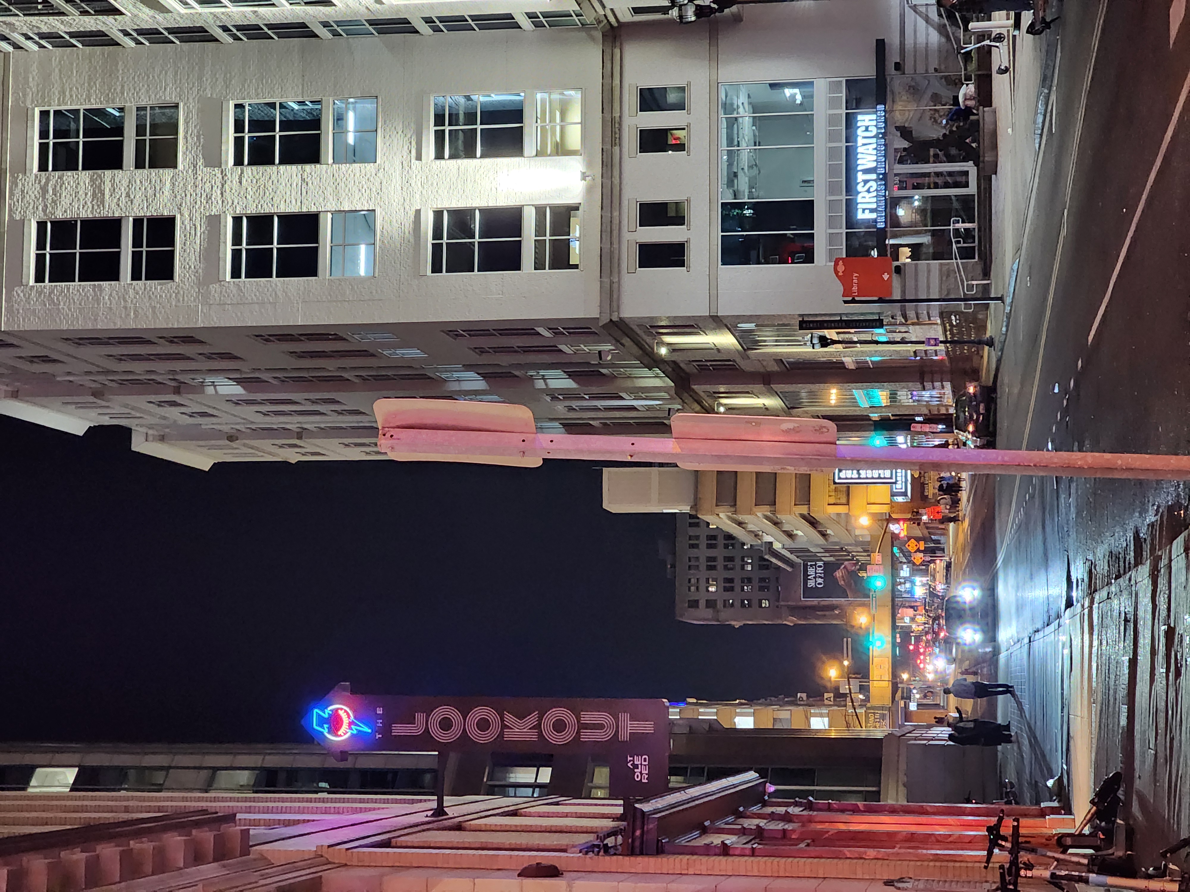 A downtown Nashville street looking toward the Noelle hotel at night.