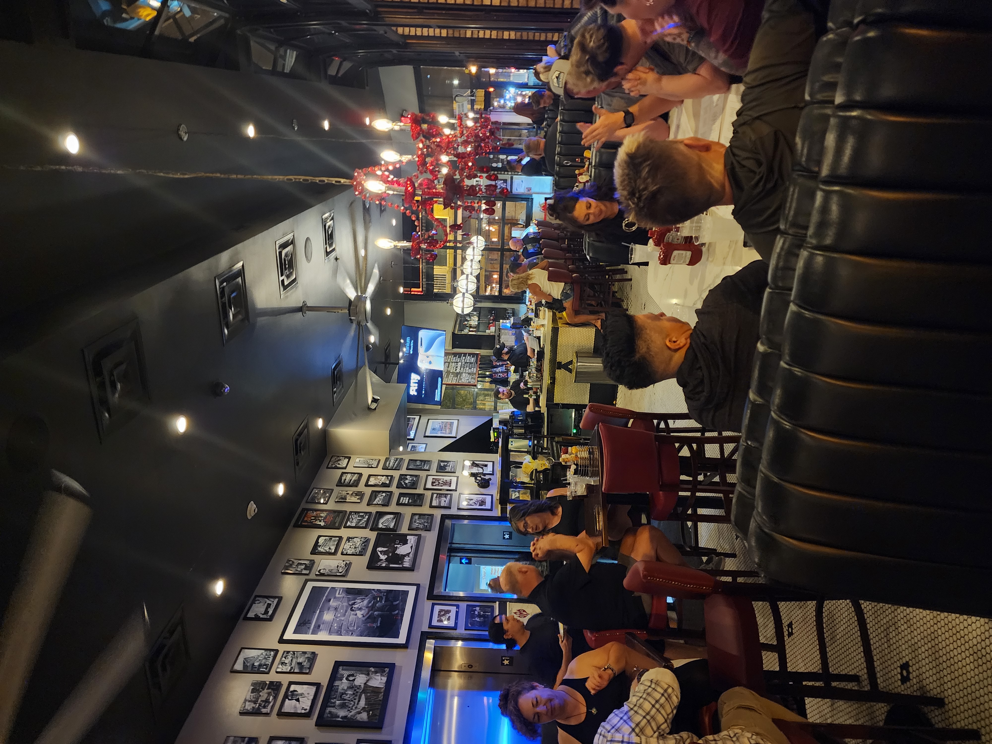 A dense Lower Broadway nightlife crowd viewed from above.