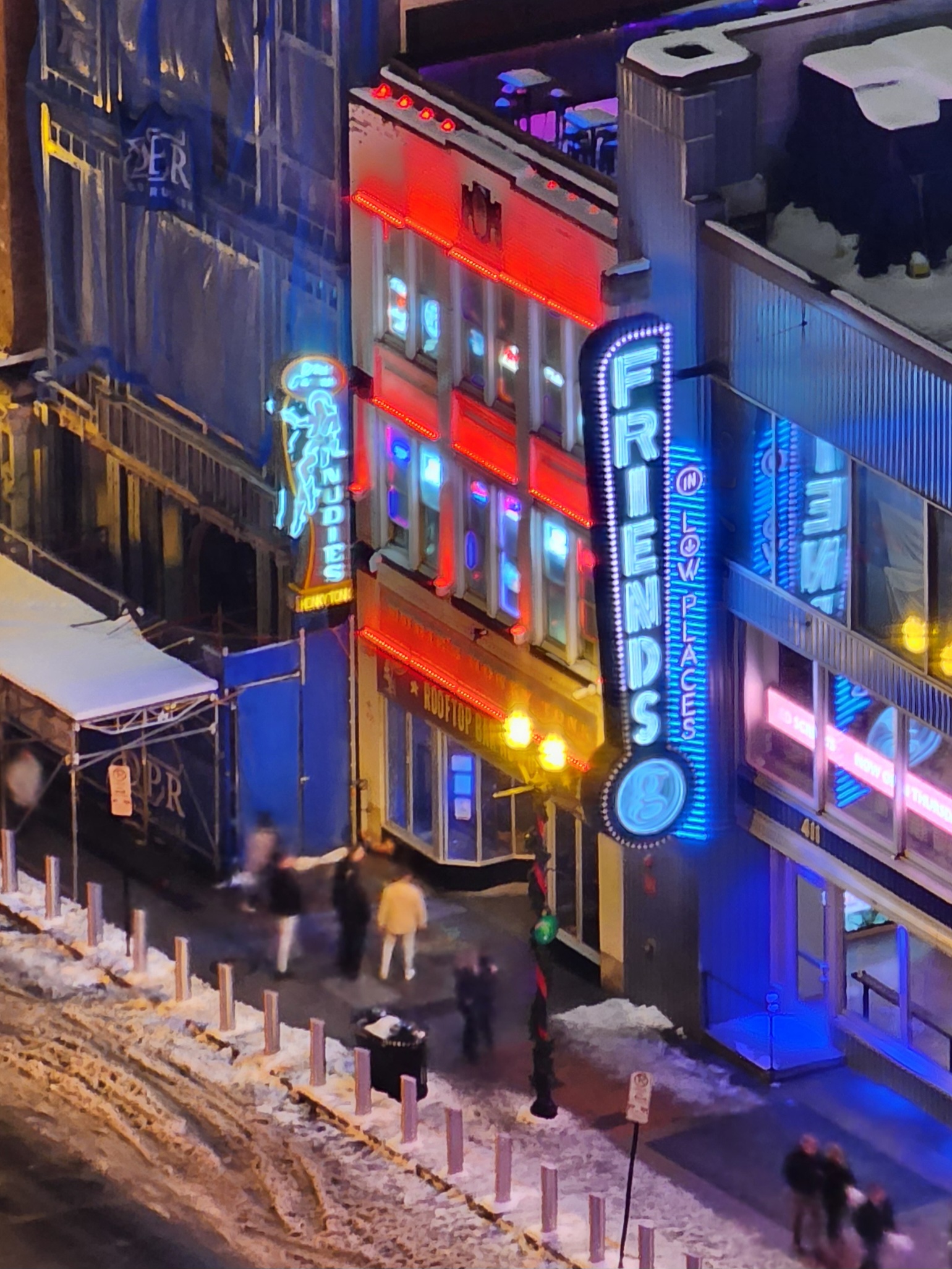 The Printer's Alley entrance covered in snow at night.