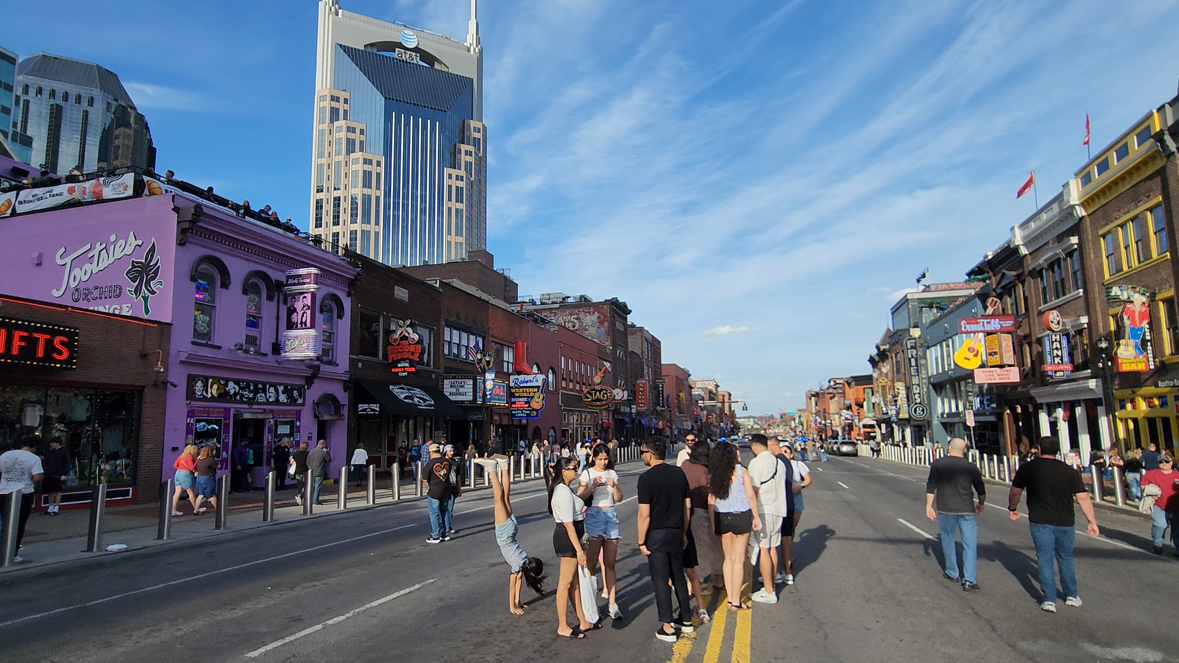 Visitors experiencing Lower Broadway during the day.