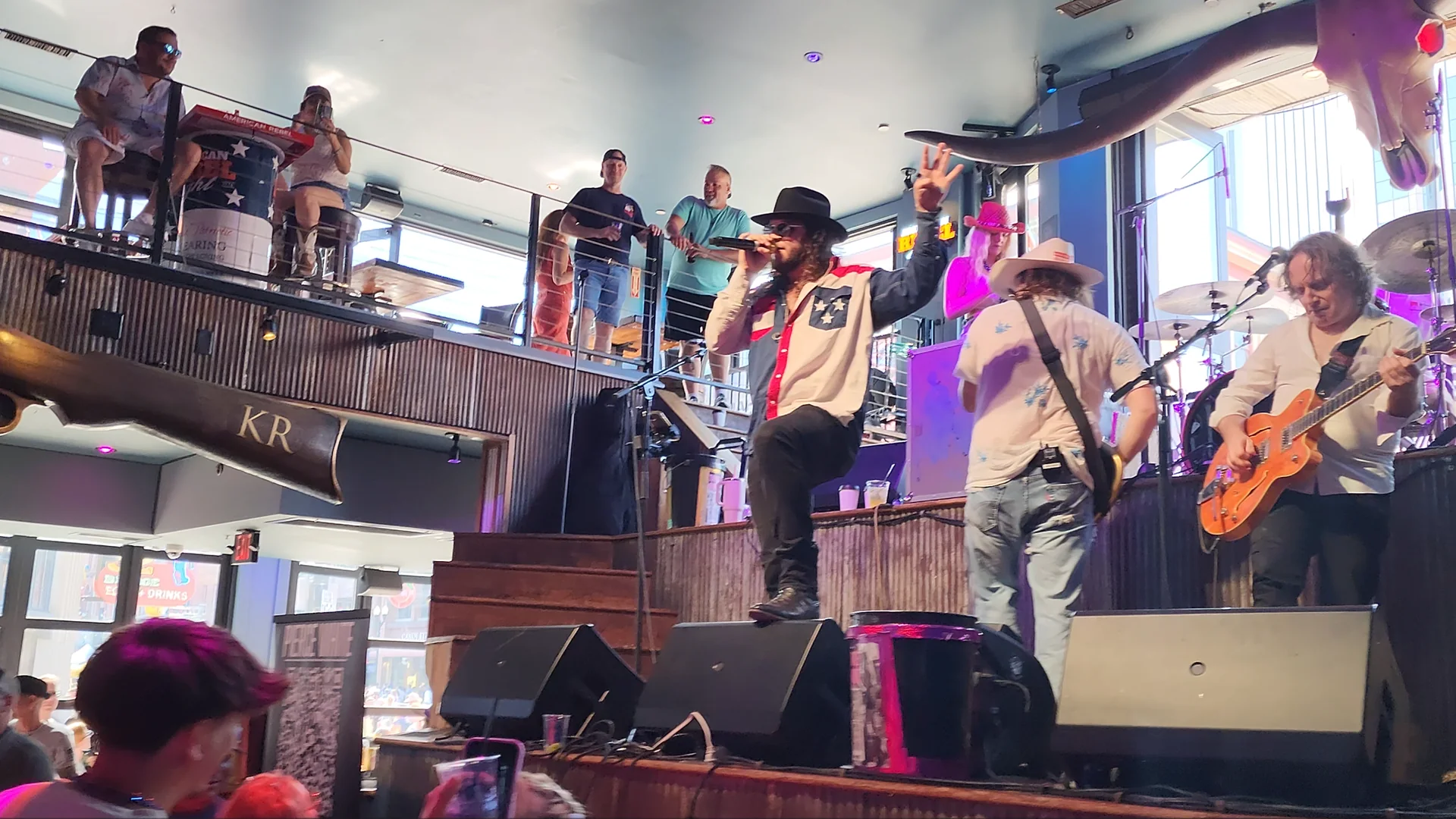 A live band performing inside a Lower Broadway honky-tonk during the daytime.